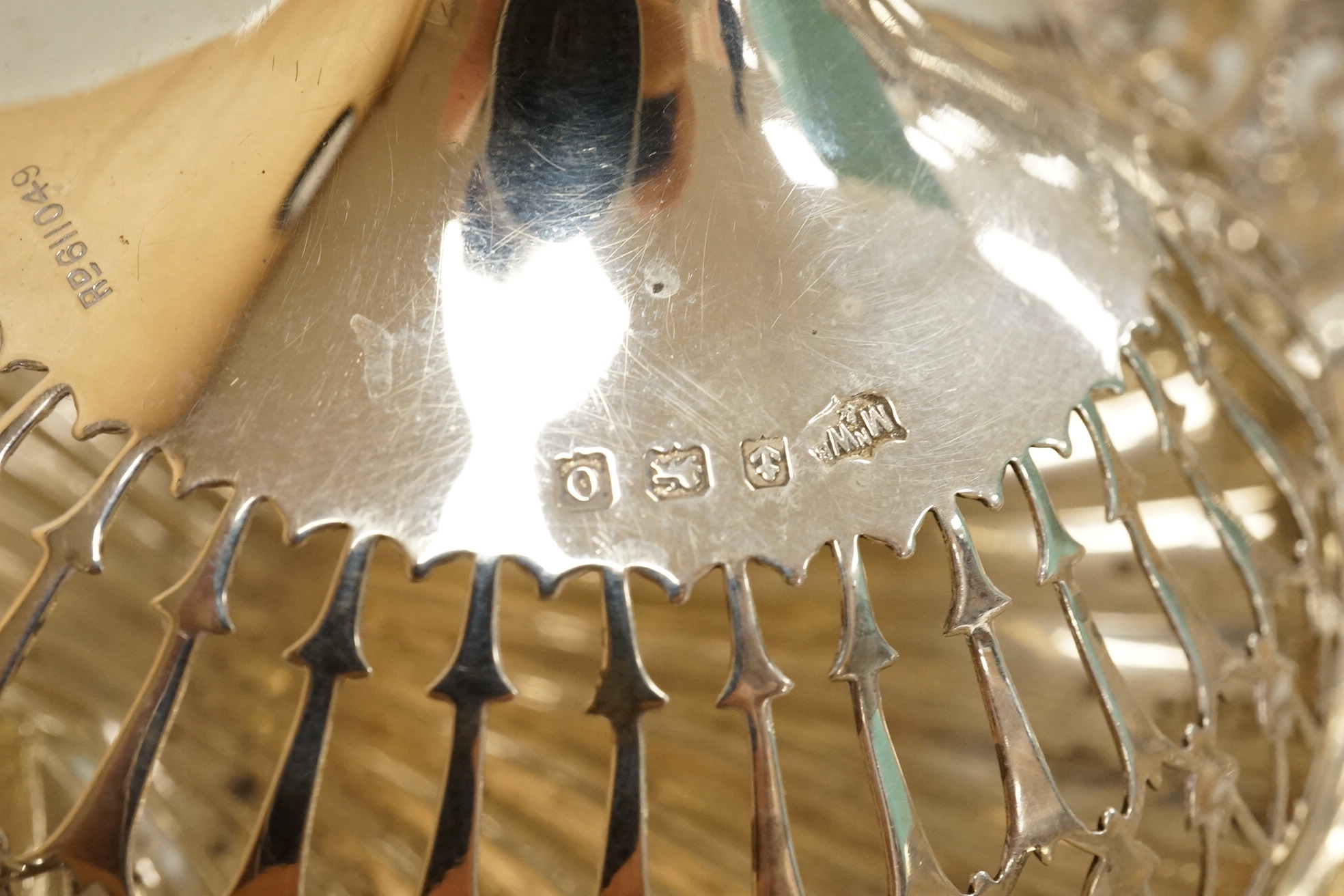 Two pairs of early 20th century silver bonbon dishes, including smallest by Mappin & Webb, Birmingham, 1913, height 6cm, together with an Edwardian silver butter shell and a pair of Edwardian silver mounted bottle coaste